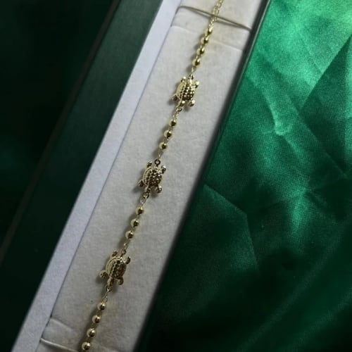 Pulsera Tortugas con Bolitas en Chapa de Oro 18k