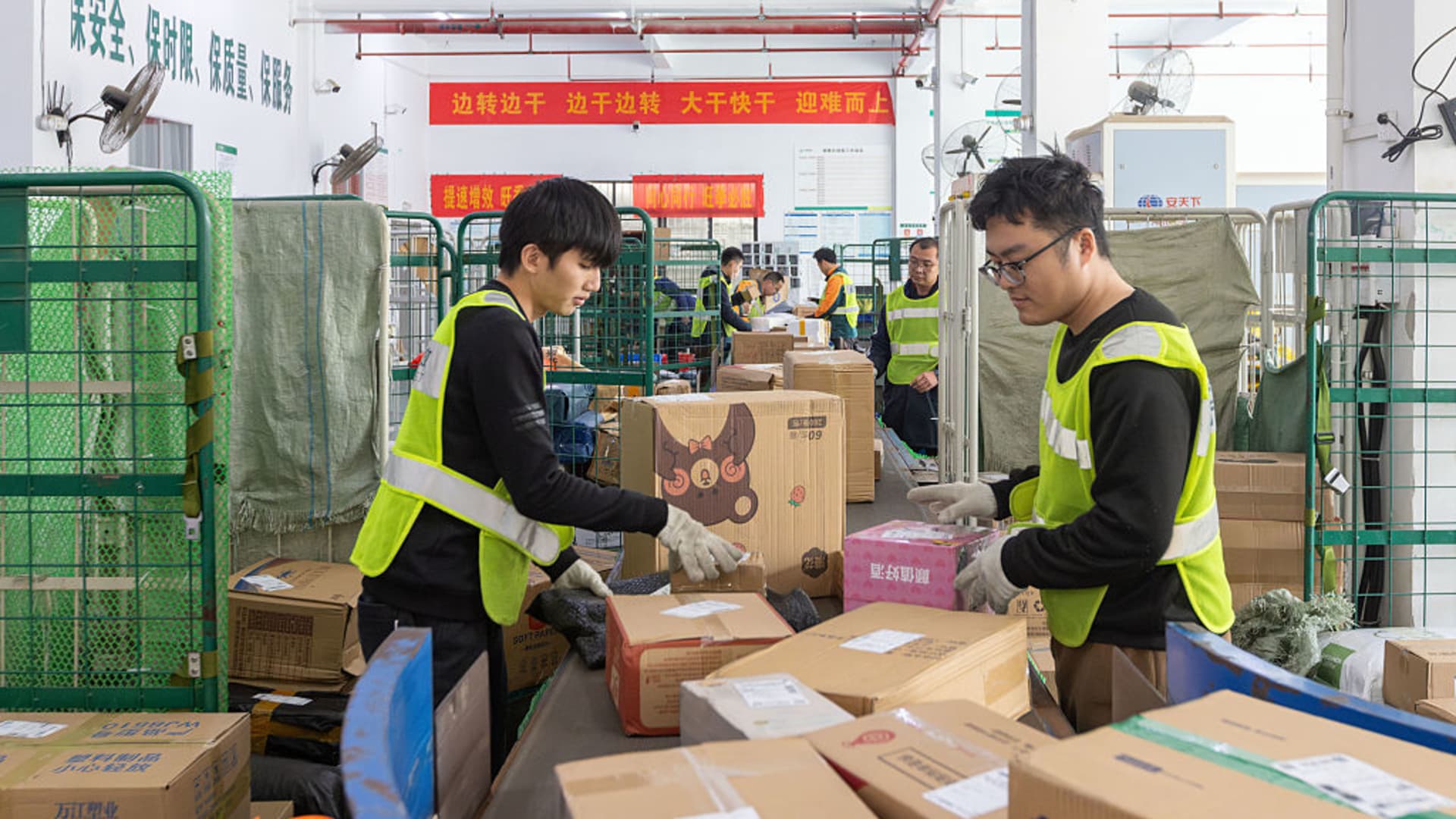 China's factory output and consumption beat forecasts, while property investment contraction slows