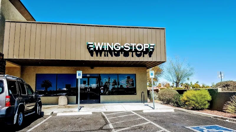 Wingstop food and storefront view at 3662 W Ina Rd Ste 110 in Tucson, Arizona
