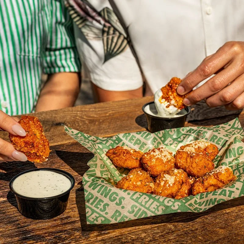 Wingstop food and storefront view at 502 E. Bellevue Rd in Atwater, California