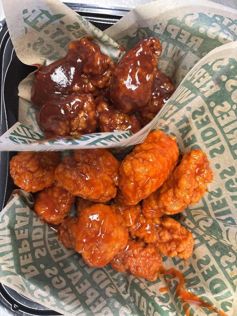 Wingstop food and storefront view at 27993 Greenspot Road in Highland, California