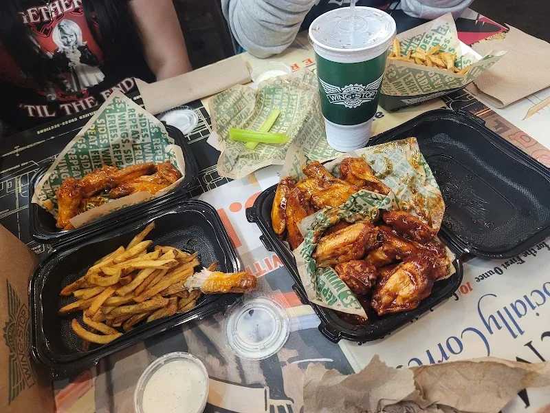 Wingstop food and storefront view at 2180 W Cleveland Ave Ste 116 in Madera, California