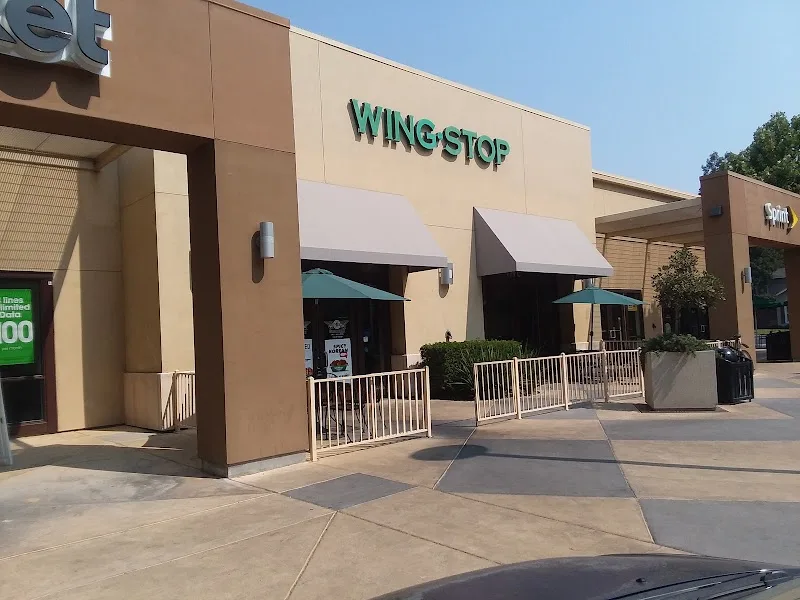 Wingstop food and storefront view at 779 E Yosemite Ave Ste D in Merced, California