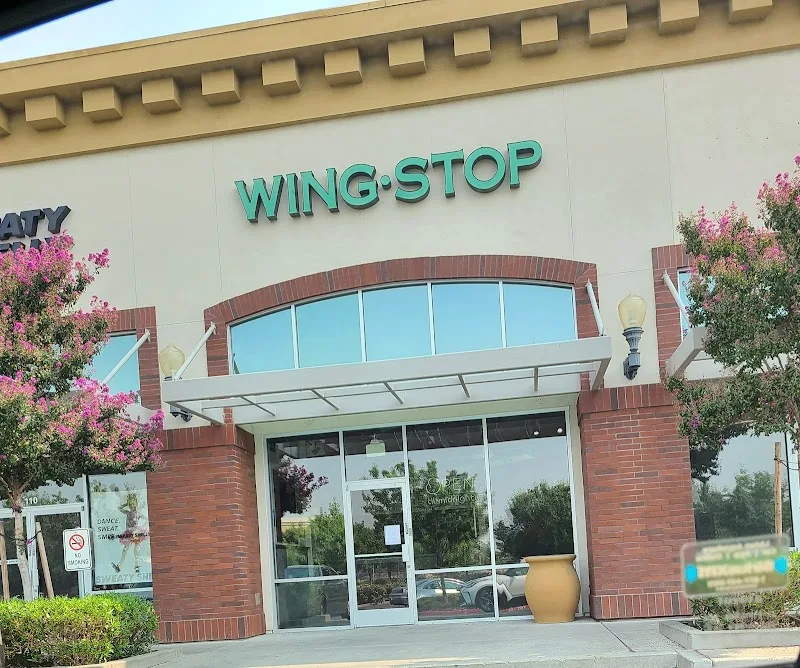 Wingstop food and storefront view at 3541 N Freeway Blvd in Sacramento, California