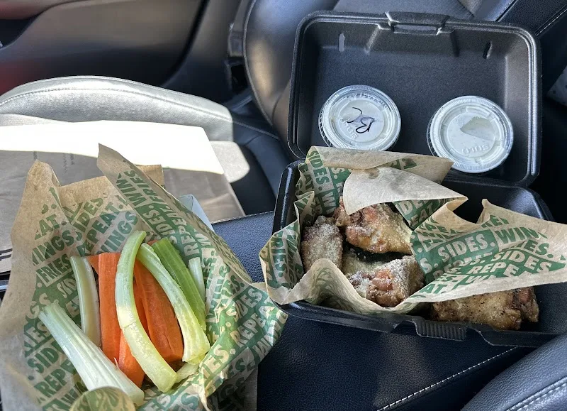 Wingstop food and storefront view at 15683 Roy Rogers Dr. in Victorville, California