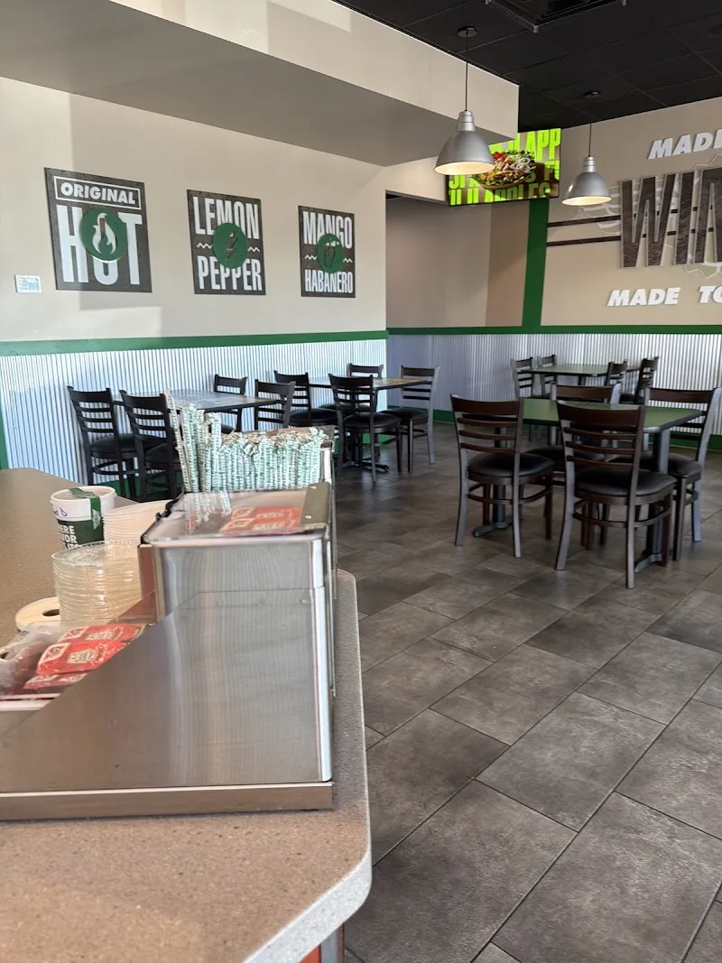 Wingstop food and storefront view at 805 NW 119th St. in Miami, Florida