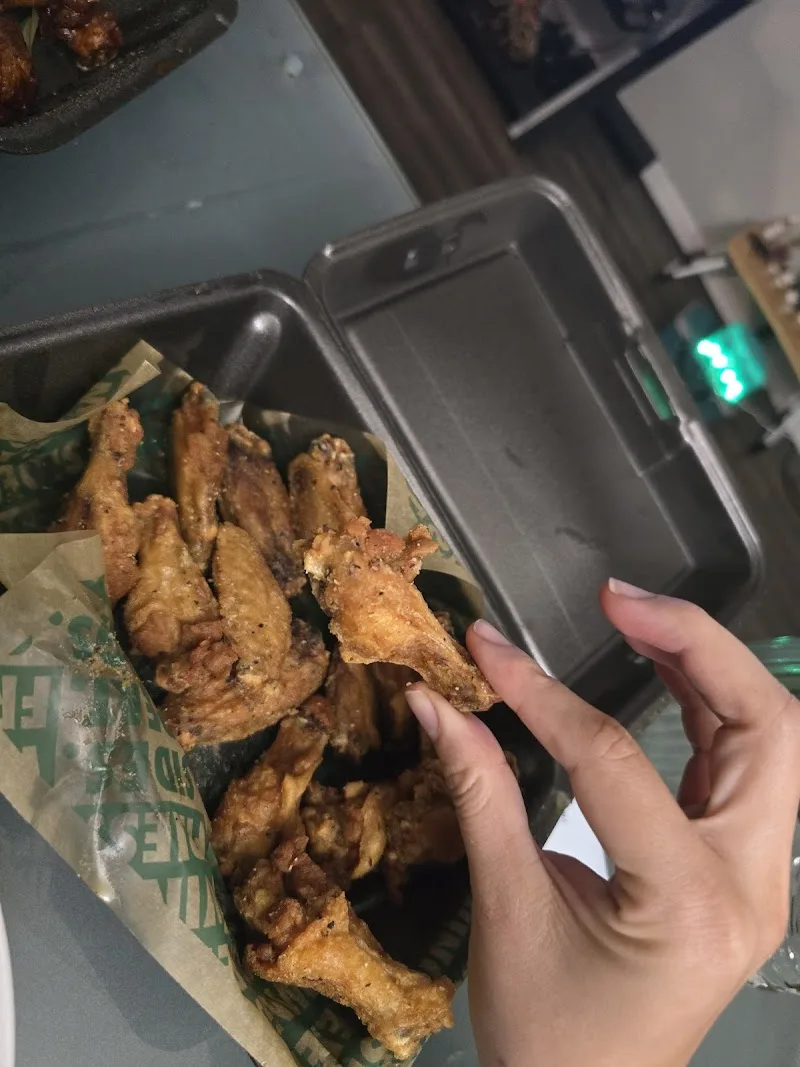 Wingstop food and storefront view at 3611 W Hillsborough Ave in Tampa, Florida