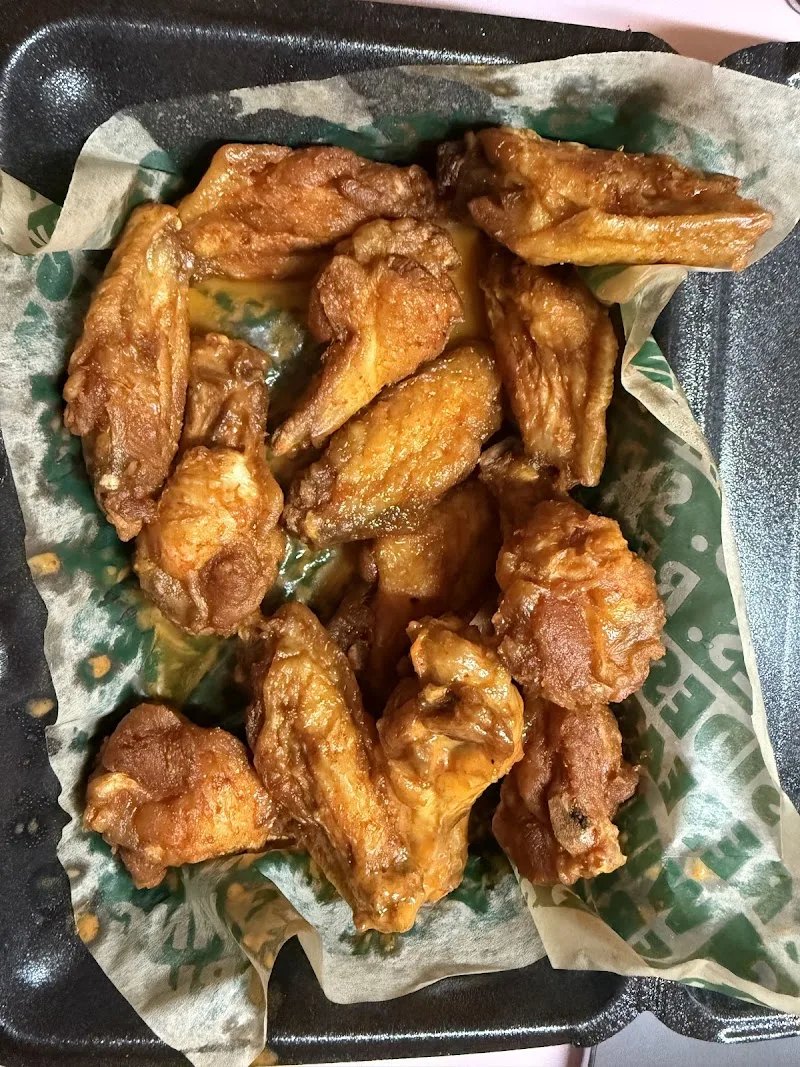 Wingstop food and storefront view at 2570 Pleasant Hill Rd Ste 104 in Duluth, Georgia