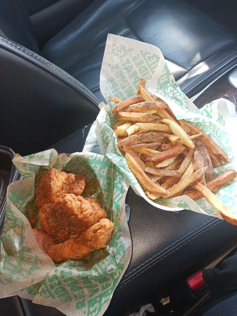 Wingstop food and storefront view at 3630 Marketplace Blvd Suite 830 in East Point, Georgia