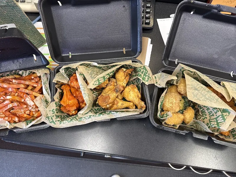 Wingstop food and storefront view at 3120 Manawa Centre in Council Bluffs, Iowa