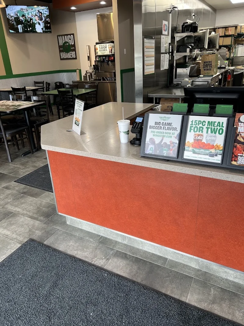 Wingstop food and storefront view at 845 S. Perryville Rd 115 in Rockford, Illinois
