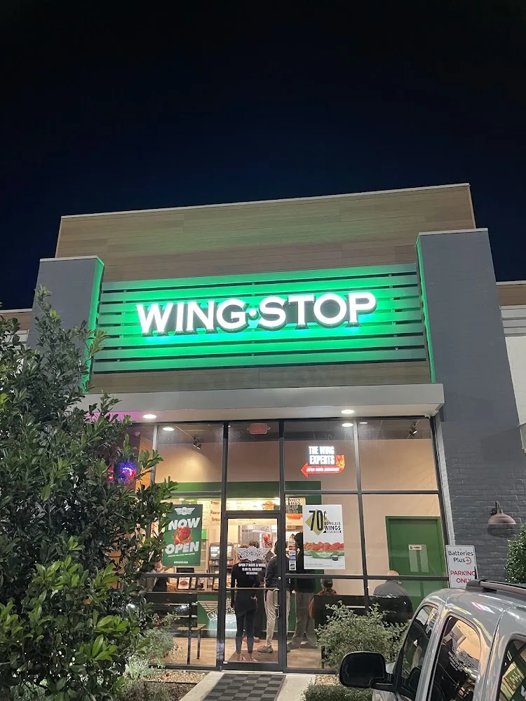 Wingstop food and storefront view at 3500 NE Evangeline Thruway in Carencro, Louisiana