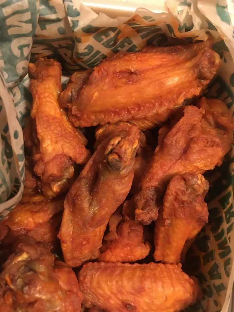 Wingstop food and storefront view at 651 Terry Pkwy Ste 112 in Gretna, Louisiana