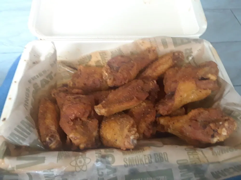 Wingstop food and storefront view at 3034 S Sherwood Forest Blvd Ste 1B in Baton Rouge, Louisiana