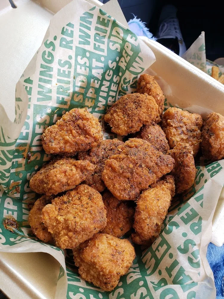 Wingstop food and storefront view at 9600 Florida Blvd Ste 100 in Baton Rouge, Louisiana
