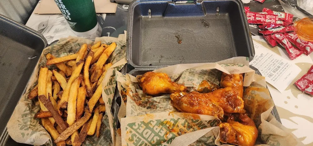 Wingstop food and storefront view at 8100 W Judge Perez Dr Ste 2 in Chalmette, Louisiana