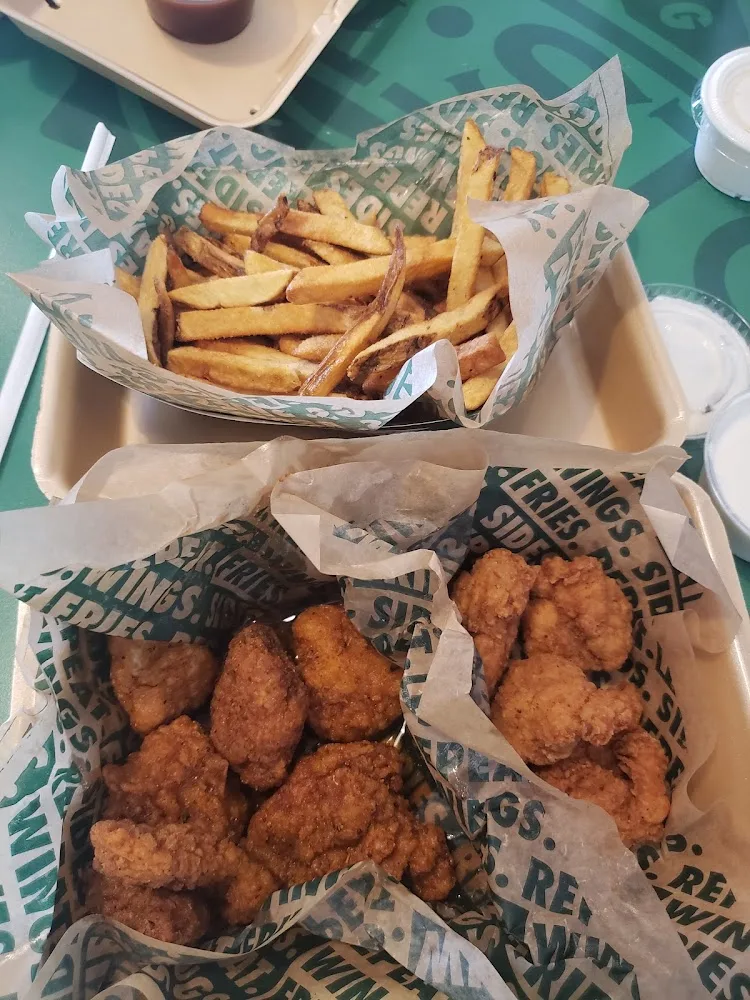 Wingstop food and storefront view at 2865 Ambassador Caffery Pkwy Ste 113 in Lafayette, Louisiana