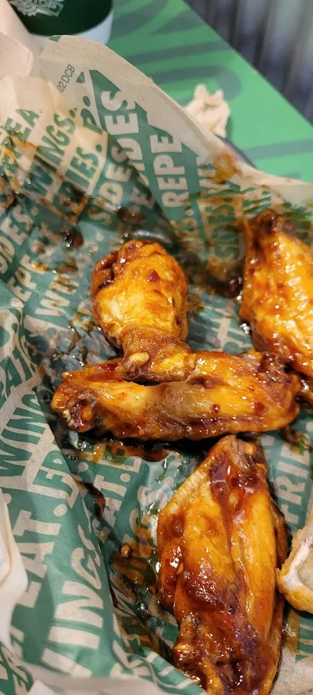 Wingstop food and storefront view at 122 S Airline Hwy in Gonzales, Louisiana