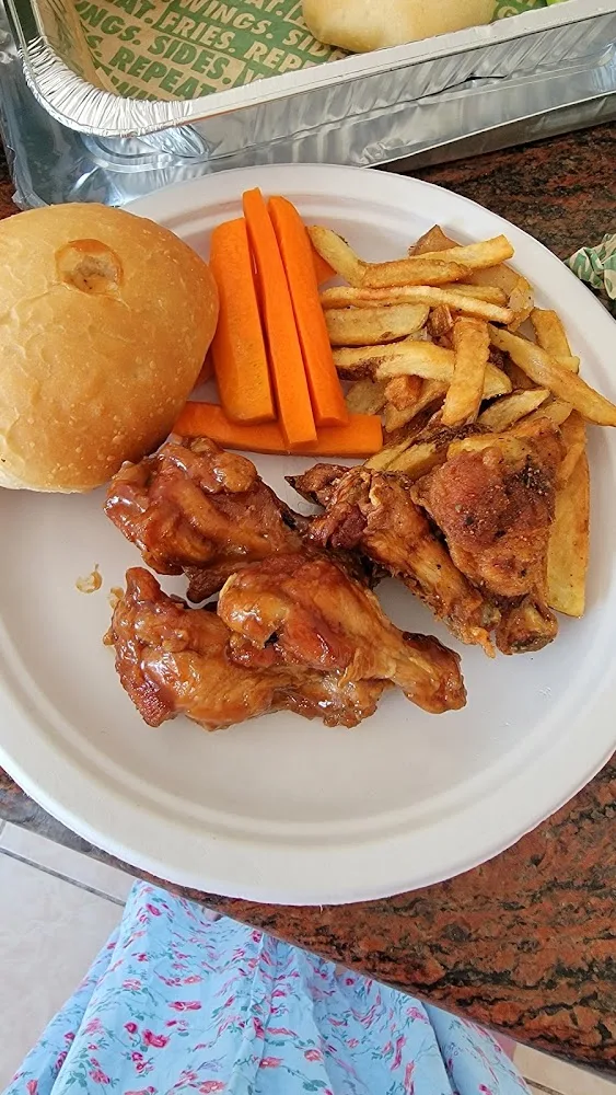 Wingstop food and storefront view at 20201 Goshen Rd in Gaithersburg, Maryland