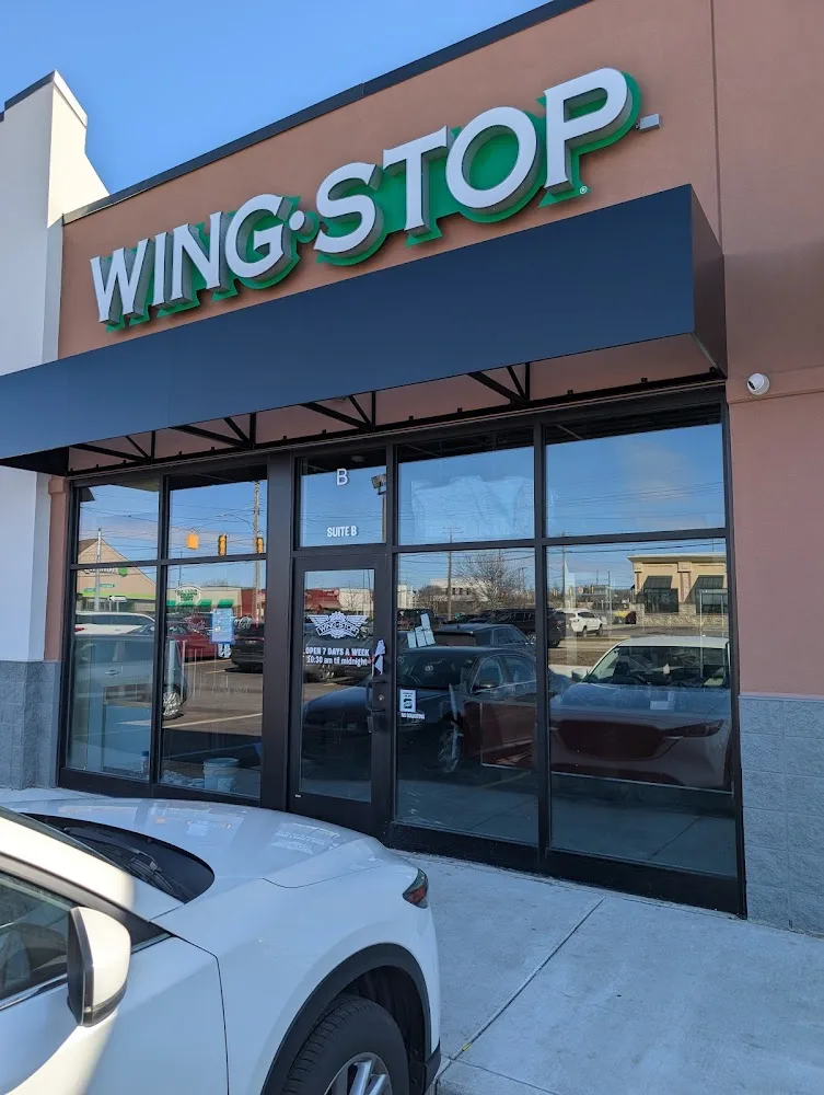 Wingstop food and storefront view at 3106 E. Saginaw St in Lansing, Michigan