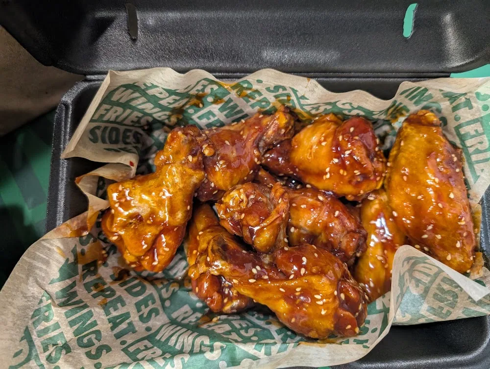 Wingstop food and storefront view at 2209 N. Telegraph Rd in Monroe, Michigan