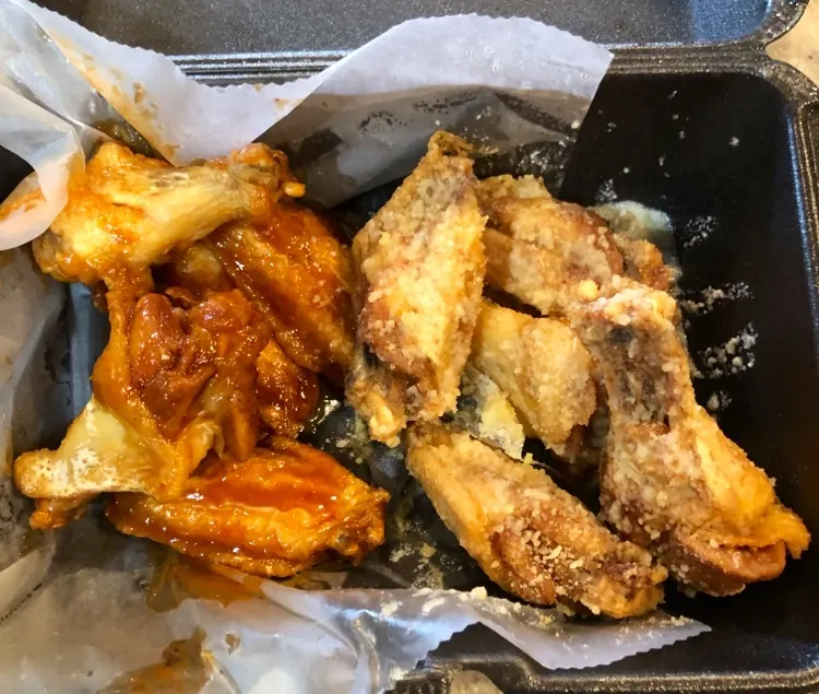Wingstop food and storefront view at 5857 W. Saginaw Hwy in Lansing, Michigan
