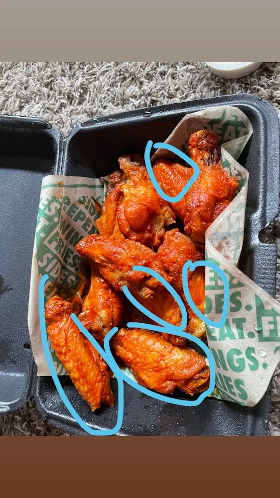 Wingstop food and storefront view at 7534 149th St. W in Apple Valley, Minnesota