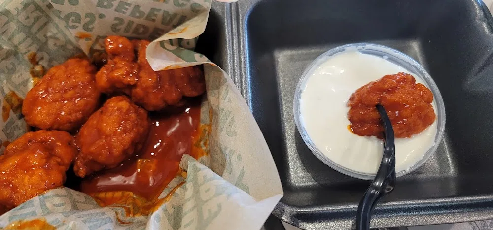 Wingstop food and storefront view at 9678 Colorado Ln N in Brooklyn Park, Minnesota