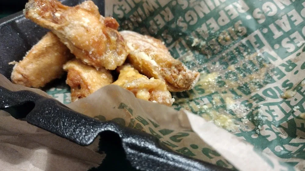 Wingstop food and storefront view at 12346 S. US 71 Highway in Grandview, Missouri