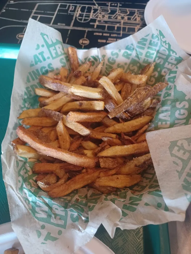 Wingstop food and storefront view at 4313 Chouteau Trafficway in Kansas City, Missouri