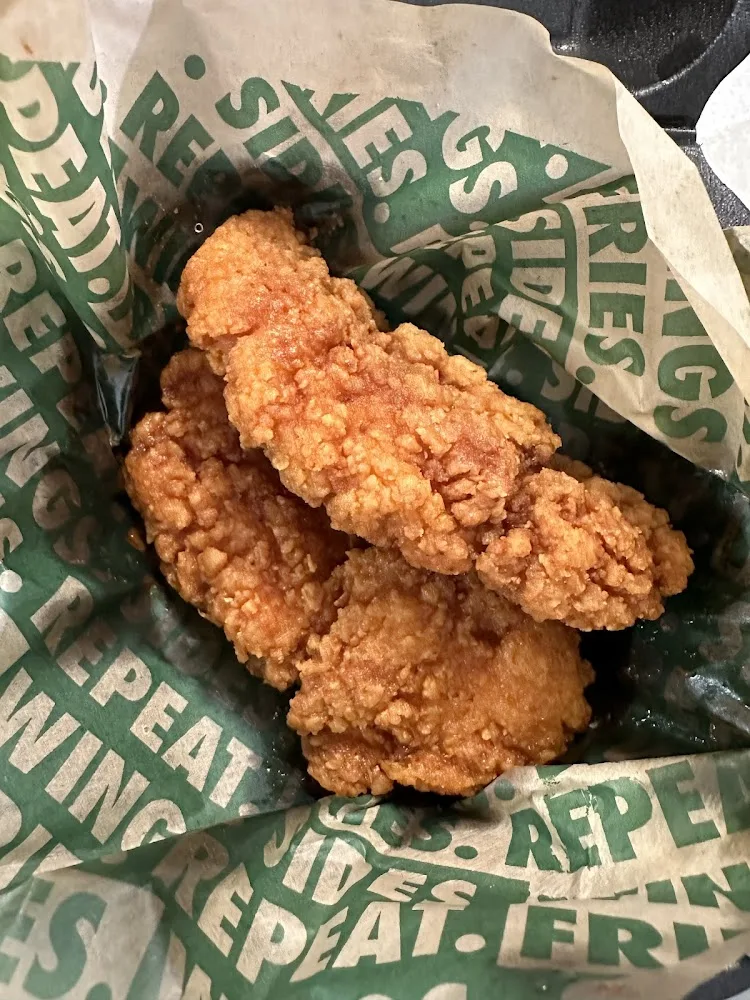 Wingstop food and storefront view at 8610 Mexico Rd in Ofallon, Missouri