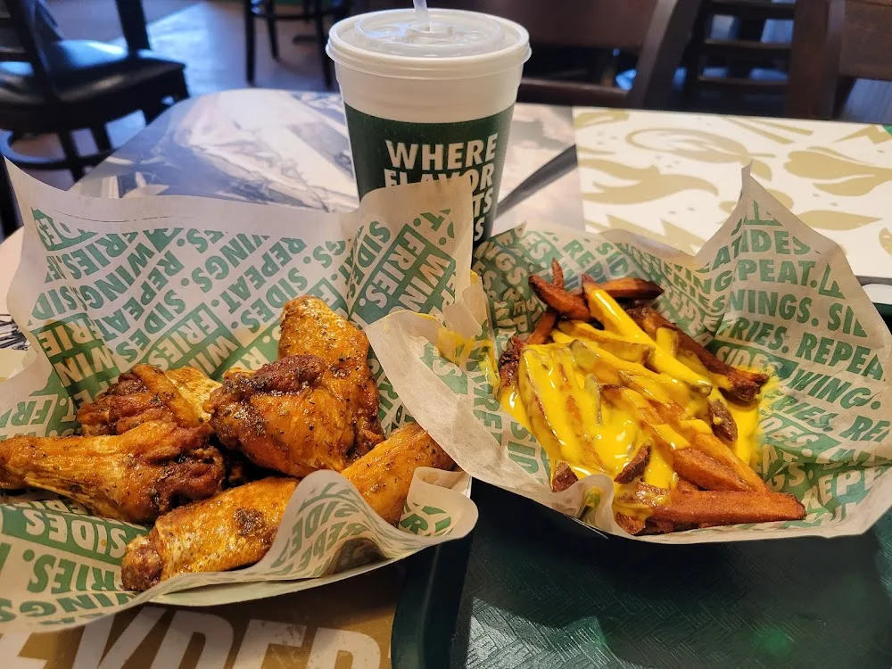 Wingstop food and storefront view at 31 NW Barry Road in Kansas City, Missouri