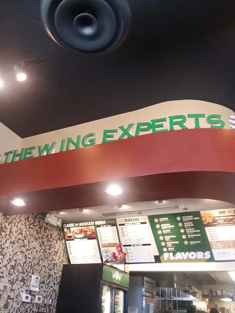 Wingstop food and storefront view at 7201 Natural Bridge Rd Ste B in Normandy, Missouri