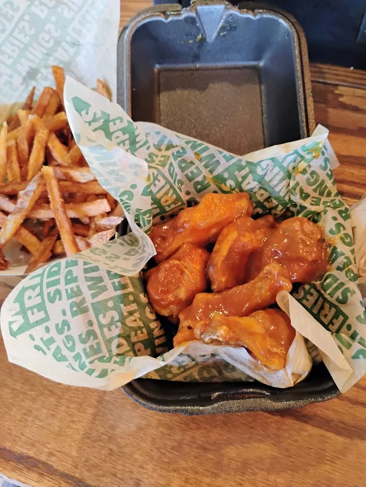 Wingstop food and storefront view at 4045 Lindell Blvd in Saint Louis, Missouri
