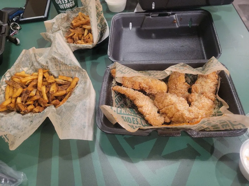 Wingstop food and storefront view at 6428 Wilkinson Blvd in Belmont, North Carolina