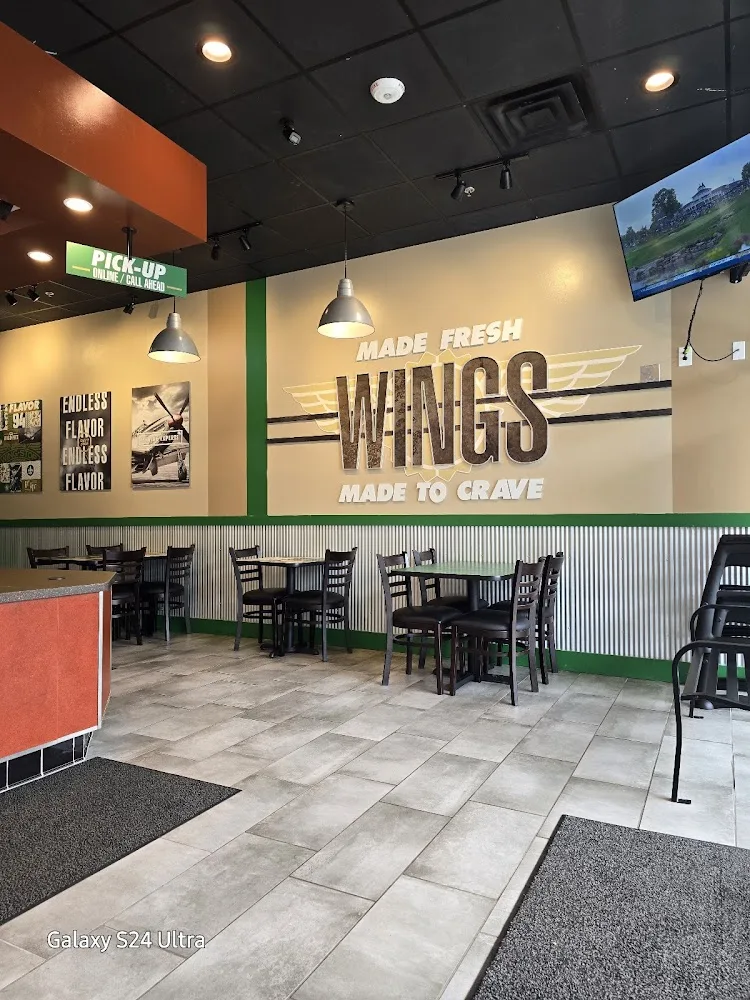 Wingstop food and storefront view at 9020 Albermarle Rd in Charlotte, North Carolina