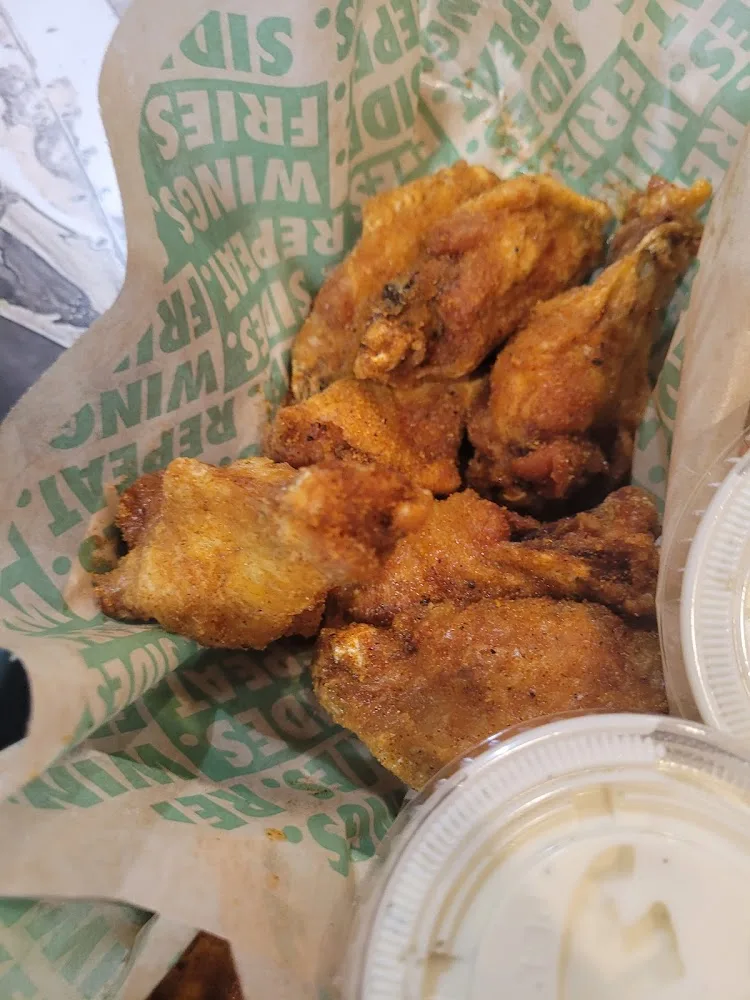 Wingstop food and storefront view at 8334 Pineville Matthews Rd Ste 105 in Charlotte, North Carolina
