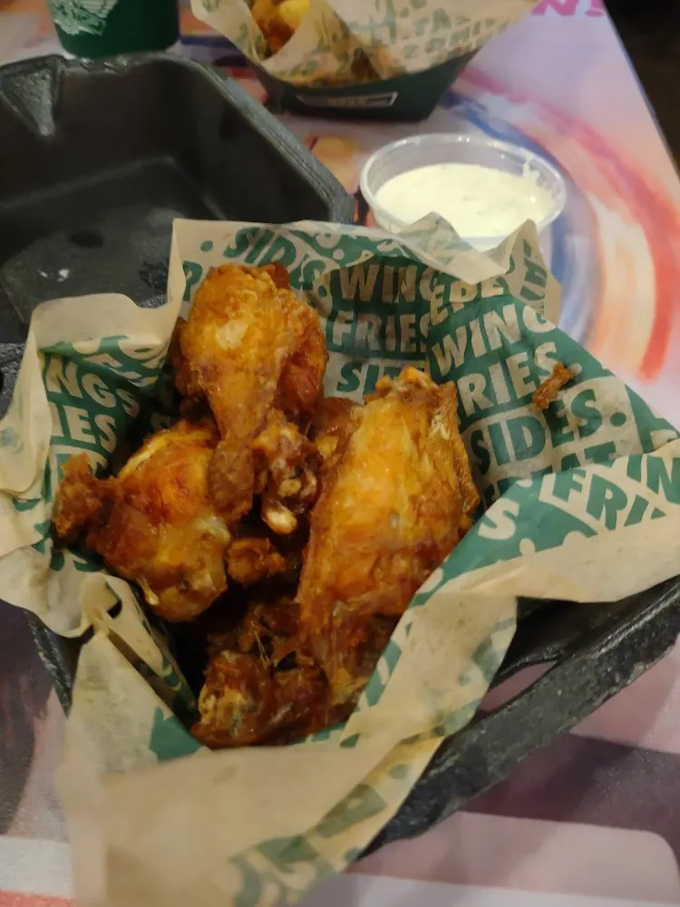 Wingstop food and storefront view at 7104 NC HWY 751 in Durham, North Carolina