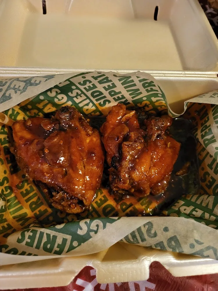 Wingstop food and storefront view at 1885 E. Fire Tower Rd in Greenville, North Carolina