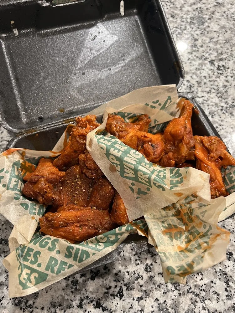 Wingstop food and storefront view at 6008 Taylor Rd in Wendell Falls, North Carolina