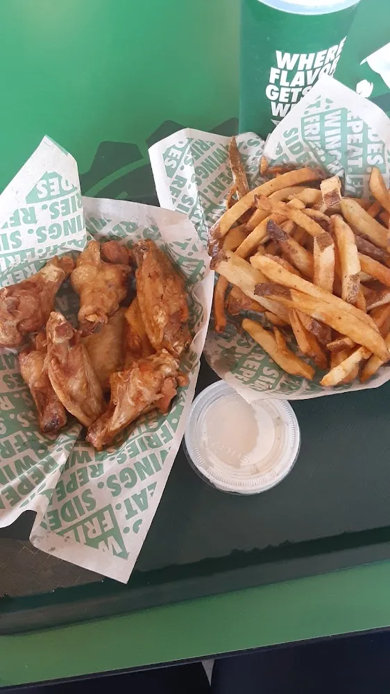 Wingstop food and storefront view at 415 S. Washington Ave in Bergenfield, New Jersey