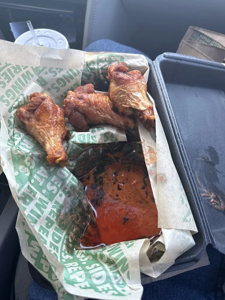 Wingstop food and storefront view at 1625 Rio Bravo Blvd SW Suite 9 in Albuquerque, New Mexico