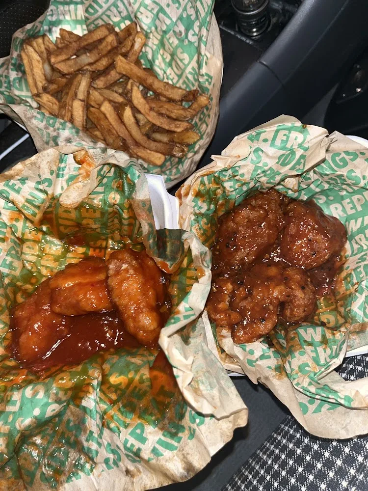 Wingstop food and storefront view at 5625 Broadway in Bronx, New York