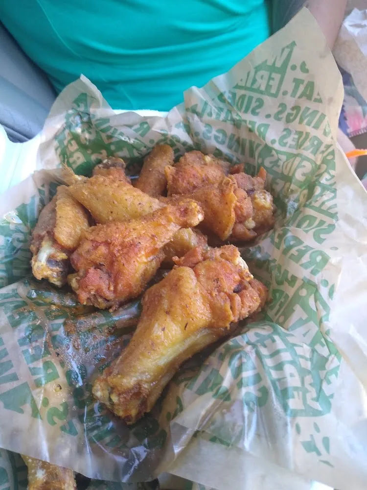 Wingstop food and storefront view at 935 Broadway in Brooklyn, New York