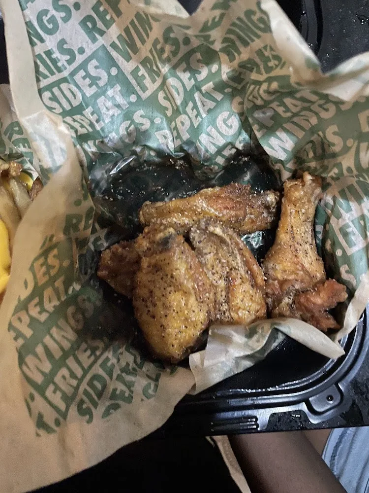 Wingstop food and storefront view at 1902 Ralph Ave in Brooklyn, New York
