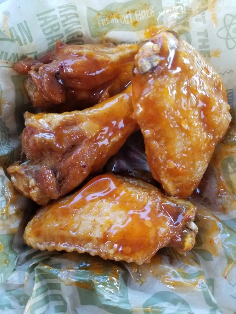 Wingstop food and storefront view at 700 Utica Ave in Brooklyn, New York