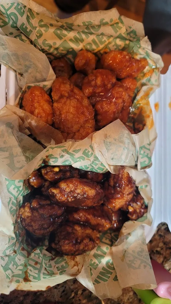 Wingstop food and storefront view at 1397 Hempstead Turnpike in Elmont, New York