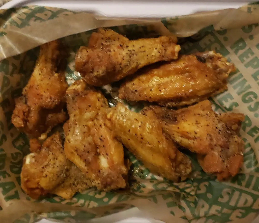 Wingstop food and storefront view at 129 W. Sunrise HWY in Freeport, New York