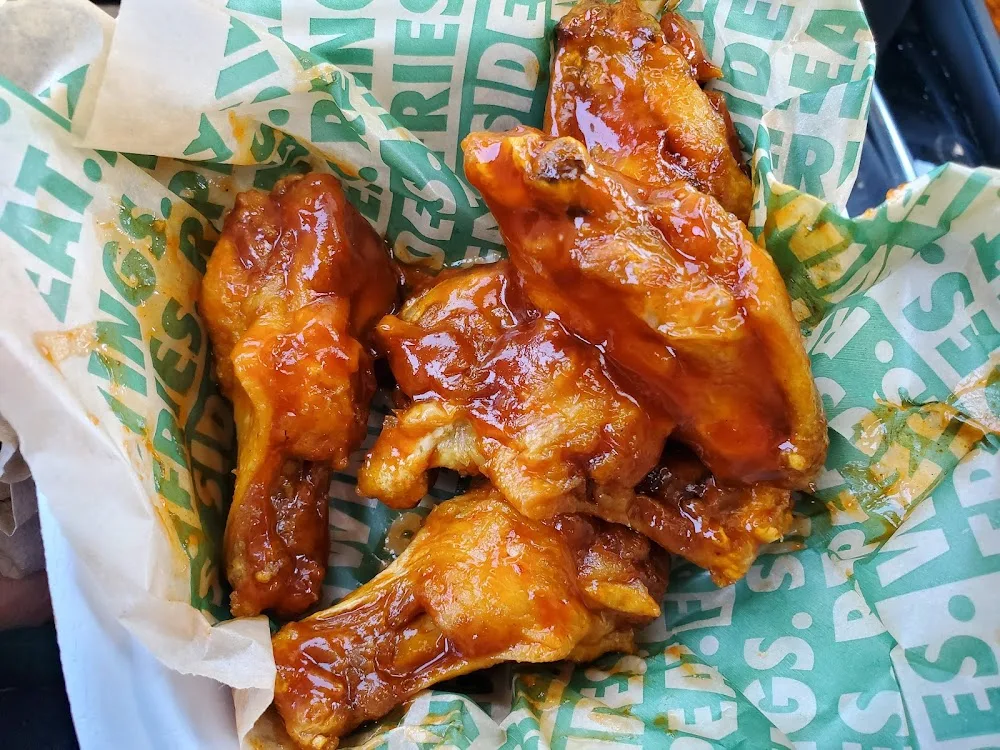 Wingstop food and storefront view at 61-22 Fresh Pond Road in Middle Village, New York