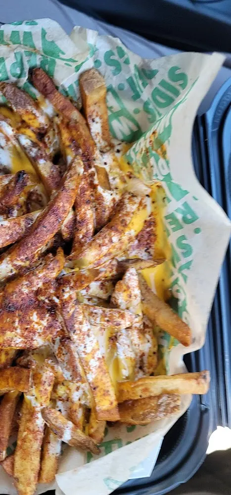 Wingstop food and storefront view at 703 East Ridge Rd in Rochester, New York